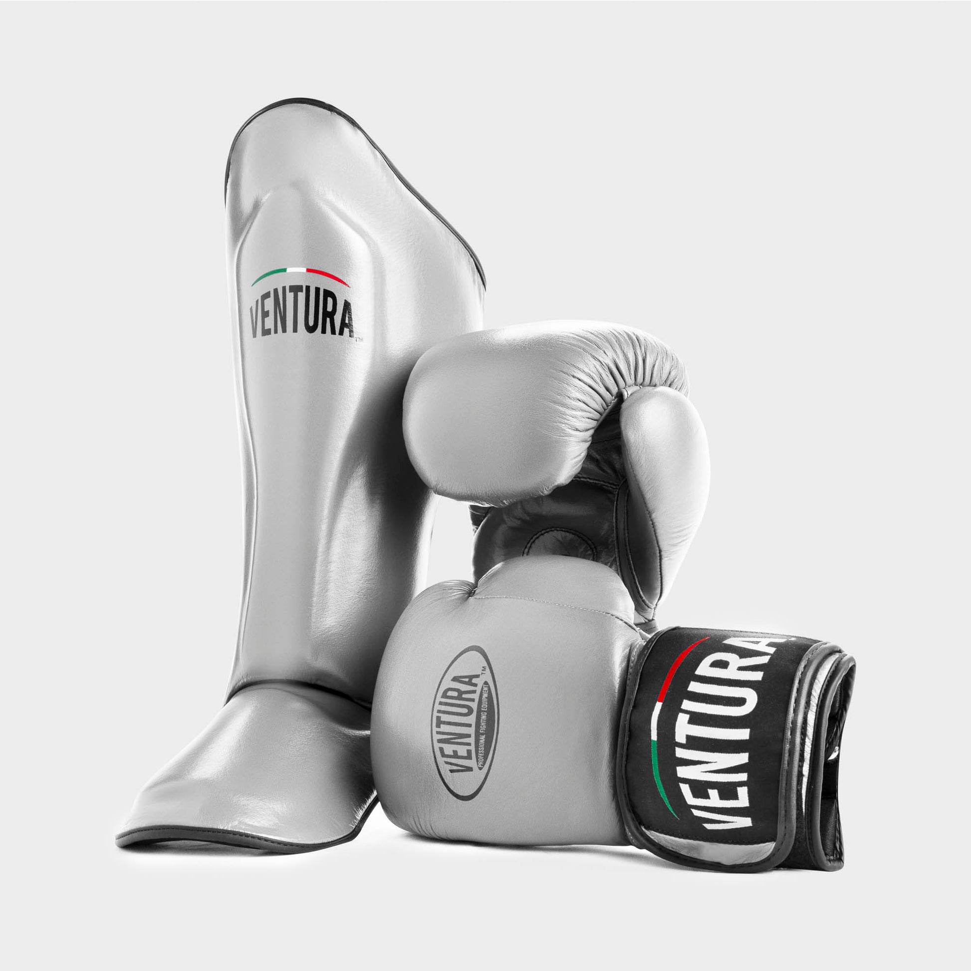 Genuine leather boxing gloves and shin guards for Muay Thai and kickboxing - silver
