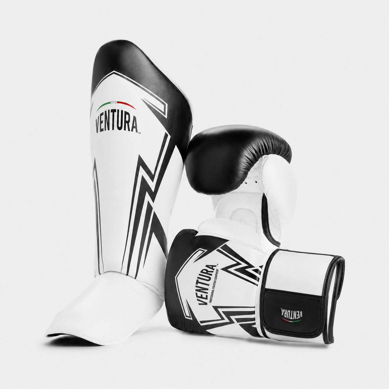 Genuine leather boxing gloves and shin guards for Muay Thai and kickboxing - arrow, black/white