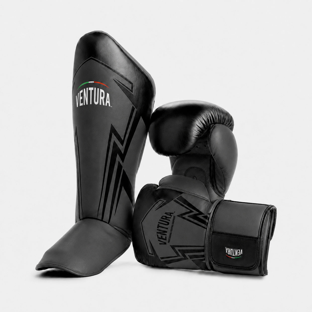 Genuine leather boxing gloves and shin guards for Muay Thai and kickboxing - arrow, matte black/glossy black